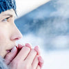 Woman warming hands in cold weather, with visible dead skin in winter