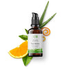 Face serum bottle with aloe vera and orange ingredients on white background